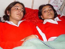 Reena and Sona, who were injured when a police vehicle hit them on Monday, at Civil Hospital