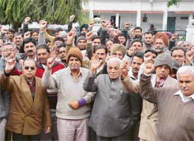 MES contractors hold a demonstration outside the GE North office in Ambala Cantonment on Monday