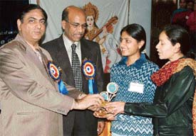 Kurukshetra University Vice-Chancellor A.K. Chawla gives away prizes to winners of a state-level science exhibition in Ambala on Monday
