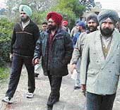 BDPO Gurmittar Singh being taken away by officials of the Vigilance Bureau after he was caught taking bribe from a former sarpanch of Chakhi village on Tuesday. 