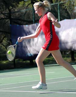 Iryna Khatsko of Ukraine returns a forehand shot during her first round match against Justina Derungs of Switzerland in the SAIL-ITF Junior Tennis Grade 3 Tournament in Chandigarh on Tuesday
