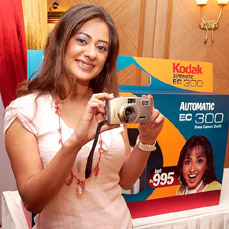 A model showcases a new range of Kodak automatic camera in Mumbai on Wednesday.