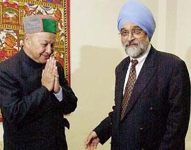 Himachal Pradesh Chief Minister Virbhadra Singh greets Deputy Chairman of Planning Commission Montek Singh Ahluwalia in New Delhi on Wednesday.