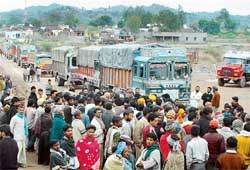 Mining labourers and villagers block the Chandi Mandir-Burj Kotian road in protest against the death of a labourer in a stone quarry on Thursday morning. 