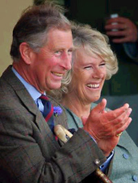 Britains Prince Charles and his partner Camilla Parker-Bowles watch the Mey Highland Games