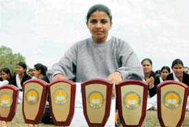 Manpreet Cheema with her trophies at the annual athletics meet of Khalsa College for women, Civil Lines, Ludhiana, on Friday