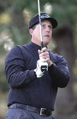 Phil Mickelson tees off on the second hole of the Spyglass Hill golf course during the first round of the AT&T Pebble Beach National Pro-Am, in Pebble Beach, California, on Thursday. Mickelson shot a 62 on the day, breaking the course record by two strokes.