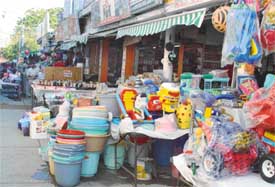 Shopkeepers encroach on parking place in front of their shops to display wares in Panchkulas Sector 7 market