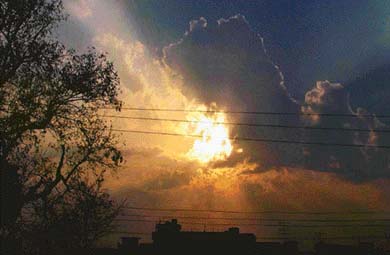 Sun shines from behind the clouds in Ludhiana on Saturday. 