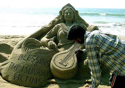 Renowned sand artist Sudarsan Pattnaik giving final touches to an idol of Goddess Saraswati