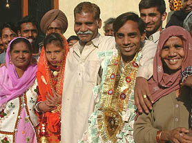 Rashid Masih, a Pakistan national, with a newly married couple and his sister Anoop Kaur (extreme right) at Lopoke village in Amritsar on Saturday.