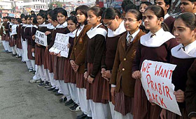 Children of DAV Public School, Amritsar, stage a silent demonstration outside their school demanding the release of their schoolmate Prabir Singh on Saturday.