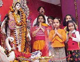 Children worship Goddess Saraswati at a function organised by the Bangiya Sanskriti Sammilini at the Bangiya Bhavan in Chandigarh on Sunday