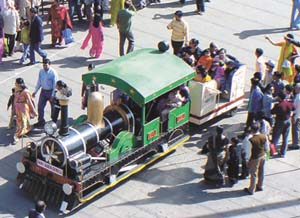 Visitors enjoying a ride on Fairy Queen during the Rail Mela at Baroda House in the Capital