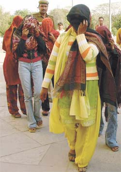 Five call girls, arrested from Mayur Vihar by the Delhi Police, being produced at Kakardooma Court in the Capital