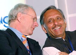 Union Petroleum Minister Mani Shankar Aiyar (R) talks to George H.B. Verberg, president of International Gas Union, during the 3rd Asia Gas Buyers Summit in New Delhi on Monday. 