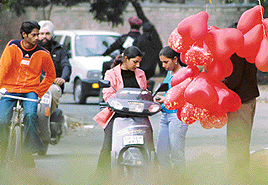 Girls buy hearts-shaped balloons on Madhya Marg near GCG, Sector 11, Chandigarh, on Monday.