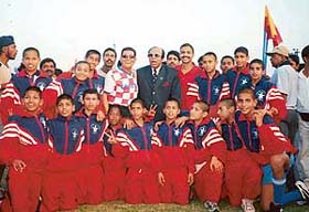 Members of St. Stephens Football Academy pose for a photograph with P.K. Banerjee, Arjuna and Padmashree awardee