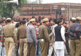 Police personnel outside the Kirori Mal College after the clash between students and residence of Chandrawal village in the Capital