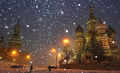 Pedestrians pass by the Moscow Kremlin on Monday, with some of the Red Square landmarks in the background