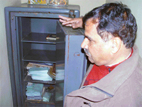 Mr Narender Mohan Bhanot, branch manager, Allahabad Bank, Shahpur village, shows the safe after an armed robbery