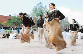 Girls participate in sack race on the opening day of the 62nd annual athletics meet of Government College for Women in Ludhiana on Wednesday. 
