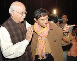 BJP Leader L.K. Advani greets veteran Bollywood actor Dev Anand during the screening of his daughter Pratibha Advani's film Ananya Bharti