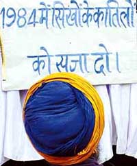 BJP workers stage a dharna demanding the release of the Nanavati Commission Report