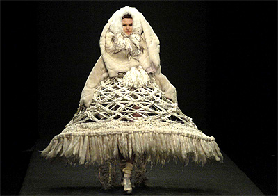 A model wears an outfit by Michiko Koshino at her catwalk show at London Fashion Week in central London on Wednesday