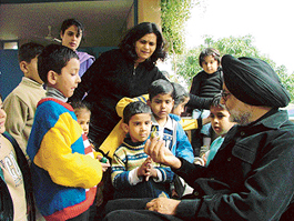 Shiv Singh interacts with students of Mango Grove School in Panchkula on Thursday. 