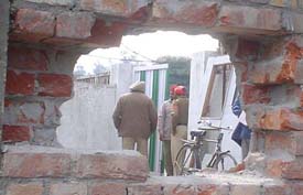 A hole made by burglars in a wall of a Oriental Bank of Commerce branch near Jalandhar bypass chowk in Ludhiana on Thursday