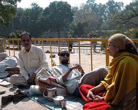 Ramesh Kumar with father Madan Lal and wife Pooja lie on a footpath outside the Emergency ward in the PGI, Chandigarh