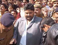 Pappu Yadav, MP, who was shifted to Tihar Jail in Delhi from Bihar, at the New Delhi railway station on Saturday.