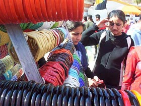 Girls purchase bangles at the crafts mela at Sheesh Mahal in Patiala on Sunday.