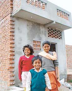 The orphan children outside their newly-built house in Chandigarh