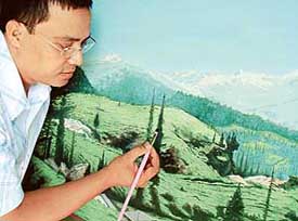 Dr Biman Saikia of the PGI, Chandigarh, gives finishing touches to one of his paintings. 