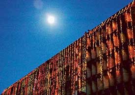 Moon finds solace in twinkiling lights as stars seem to have failed to keep date with the pearly orb. Sarojani hostel of Panjab University illuminated on the eve of Jhankar-2005 on Monday. 