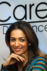 Model-cum-actress Malaika Arora smiles during the launch of a beauty product in Bangalore on Tuesday