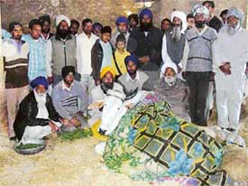 Villagers with badly injured bull Rana at Bohrayi Kalan village