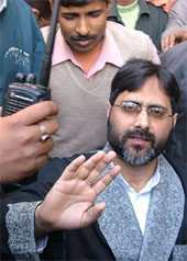 Prof S.A.R. Geelani waves to his supporters after being discharged from AIIMS in New Delhi on Tuesday. Prof Geelani was injured by an unknown gunman on February 8.