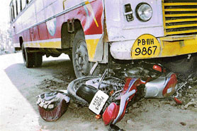 Mangled remains of a motor cycle that was hit by a bus on the Rajpura-Patiala highway on Tuesday. 