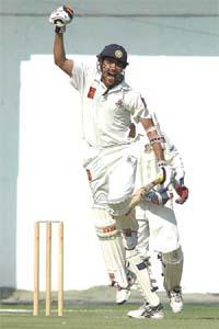 East Zones Laxmi Ratan Shukla rejoices on completing his century against Bangladesh Cricket Board XI on the first day of the Duleep Trophy match in Nagpur