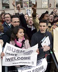 Protesters shout during a demonstration against US President Goerge W. Bush in Brussels, on Monday.