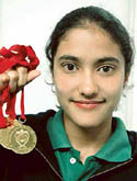 Aanchal Bajwa of Nalagarh house, YPS school with gold medals on Wednesday. 
