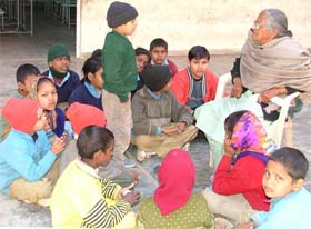 A caretaker with inmates of Bal Bhavan in Ludhiana