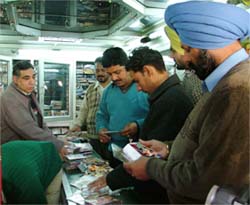 Policemen conduct a raid on a shop in connection with pirated CDs of the film, Khalsa, in Ludhiana