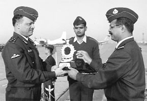AOC 12 Wing, Air Cmde T K Venugopal (right) presents the Best Transport Squadron trophy to Commanding Officer of 25 Squadron, Gp Capt S N Mohanty, in Chandigarh.