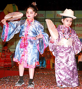 Children of ABC Nursery School wearing Chinese dresses during a fashion show in the Capital
