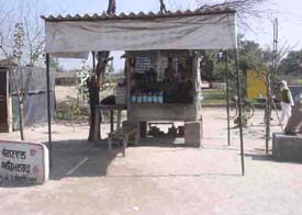 Ignorant of provisions of the Cigarettes and Other Tobacco Products Act, vendors sell cigarettes near the main gate of a government school near Mandi Ahmedgarh