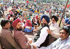 Activists of various parties at a rally near the toll barrier in Doraha on Friday